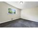 Spacious bedroom with new carpet and a large window at 3811 Reynolds Rd, Douglasville, GA 30135