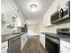 Modern kitchen with white cabinets, granite countertops, and stainless steel appliances at 3811 Reynolds Rd, Douglasville, GA 30135