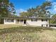 Charming ranch home with brick exterior and landscaped yard at 3811 Reynolds Rd, Douglasville, GA 30135