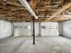 Unfinished two-car garage with high ceilings and ample storage potential at 3811 Reynolds Rd, Douglasville, GA 30135