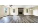 Bright living room with hardwood floors and a brick fireplace at 3811 Reynolds Rd, Douglasville, GA 30135