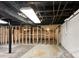 Unfinished basement with framed walls and exposed utilities at 3811 Reynolds Rd, Douglasville, GA 30135