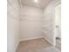 Large walk-in closet with wire shelving; provides ample storage at 1481 Stephens View Dr, Loganville, GA 30052