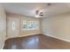 Living room with hardwood floors and large window at 7047 Carolyn Cir, Lithia Springs, GA 30122