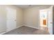 Bedroom with carpet flooring, neutral walls and an ensuite bathroom at 7047 Carolyn Cir, Lithia Springs, GA 30122