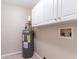 Functional laundry room with washer/dryer hookups and cabinets at 7047 Carolyn Cir, Lithia Springs, GA 30122