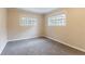 Spacious bedroom with neutral decor and carpet flooring at 7047 Carolyn Cir, Lithia Springs, GA 30122