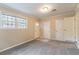 Versatile bonus room with exterior access, carpet flooring, and neutral walls at 7047 Carolyn Cir, Lithia Springs, GA 30122