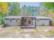 House exterior showcasing back of house and deck at 7047 Carolyn Cir, Lithia Springs, GA 30122