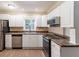 Galley kitchen with stainless steel appliances at 7047 Carolyn Cir, Lithia Springs, GA 30122