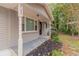 Front porch entrance with columns and landscaping at 7047 Carolyn Cir, Lithia Springs, GA 30122