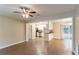 Open living room with kitchen view and hardwood floors at 7047 Carolyn Cir, Lithia Springs, GA 30122