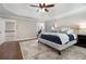 Bright main bedroom with hardwood floors and access to upper hallway at 2002 Palmetto Dunes Ct, Johns Creek, GA 30097