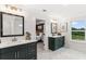 Double vanity bathroom with dark green cabinets and a modern design at 4025 Hosch Reserve Dr, Buford, GA 30519