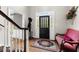 Bright entryway with hardwood floors and seating at 4250 Edgewater Nw Ct, Kennesaw, GA 30144