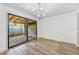 Bright dining room with chandelier and sliding glass doors to patio at 35 Willowick Dr, Lithonia, GA 30038