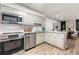 Modern kitchen with stainless steel appliances and granite countertops at 35 Willowick Dr, Lithonia, GA 30038