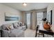 Bright bonus room with sectional sofa, workspace, and natural light at 5178 Longview Run, Decatur, GA 30035