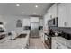 Modern kitchen with white cabinets, granite counters and stainless steel appliances at 5178 Longview Run, Decatur, GA 30035