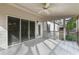 Spacious screened porch with tile floor and ceiling fan at 436 Gold Xing, Canton, GA 30114