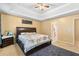 Main bedroom features a king-size bed and access to bathroom at 4092 Arabian Way, Snellville, GA 30039