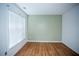 Simple bedroom with hardwood floors and a large window at 816 Buffington Way, Canton, GA 30115