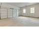 Spacious garage with overhead door and window at 3603 Squires Park Ln, Loganville, GA 30052