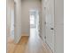 Bright hallway with light walls and hardwood floors at 3603 Squires Park Ln, Loganville, GA 30052