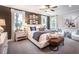 Large main bedroom with king-size bed and sitting area at 701 Crossroad Ct, Powder Springs, GA 30127