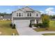 Two-story home with gray siding, white trim, and a two-car garage at 500 Appalachian Pl, Canton, GA 30114