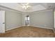 Spacious bedroom with carpet flooring and neutral walls at 105 Argonne Dr, Fayetteville, GA 30214