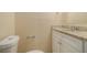 Clean bathroom with granite countertop and white cabinets at 6940 Kimberly Mill Rd, Atlanta, GA 30349