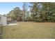 Large backyard with grassy area and trees at 6940 Kimberly Mill Rd, Atlanta, GA 30349