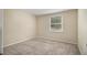 Bright bedroom featuring neutral walls and carpet at 6940 Kimberly Mill Rd, Atlanta, GA 30349