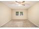 Spacious bedroom with neutral walls and carpet at 6940 Kimberly Mill Rd, Atlanta, GA 30349