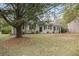 Single-story home with landscaping at 6940 Kimberly Mill Rd, Atlanta, GA 30349