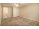 Bedroom with ceiling fan and carpet at 6940 Kimberly Mill Rd, Atlanta, GA 30349