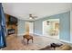 Living area with hardwood floors, fireplace and view to kitchen at 4002 Phylis Pl, Decatur, GA 30035