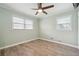 Simple bedroom with hardwood floors and neutral-colored walls at 4002 Phylis Pl, Decatur, GA 30035