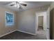 Spacious bedroom with ceiling fan and access to hallway at 2191 Miriam Ln, Decatur, GA 30032