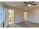 Bright bedroom with ceiling fan and en-suite bathroom access at 2191 Miriam Ln, Decatur, GA 30032