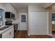 Modern kitchen with white cabinets, stainless steel appliances, and hardwood floors at 2191 Miriam Ln, Decatur, GA 30032