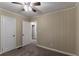 Cozy bedroom with two doors and ceiling fan at 2191 Miriam Ln, Decatur, GA 30032
