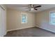 Well-lit bedroom with neutral walls, carpet, and ceiling fan at 2191 Miriam Ln, Decatur, GA 30032