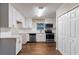 Renovated kitchen featuring white cabinets and stainless steel appliances at 2191 Miriam Ln, Decatur, GA 30032