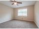 Bedroom with neutral walls, carpet, and ceiling fan at 3945 Shandra Way, Atlanta, GA 30349