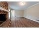 Spacious Gathering room with brick fireplace and wood-look floors at 3945 Shandra Way, Atlanta, GA 30349