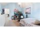 Bedroom with light blue walls, a bed, and built-in shelving at 1571 Long Acre Dr, Loganville, GA 30052