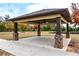 Relaxing community gazebo with ceiling fan and brick columns at 1571 Long Acre Dr, Loganville, GA 30052