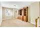 Spacious bonus room with built-in shelving and neutral carpeting at 226 Mclaren Gates Dr, Marietta, GA 30060